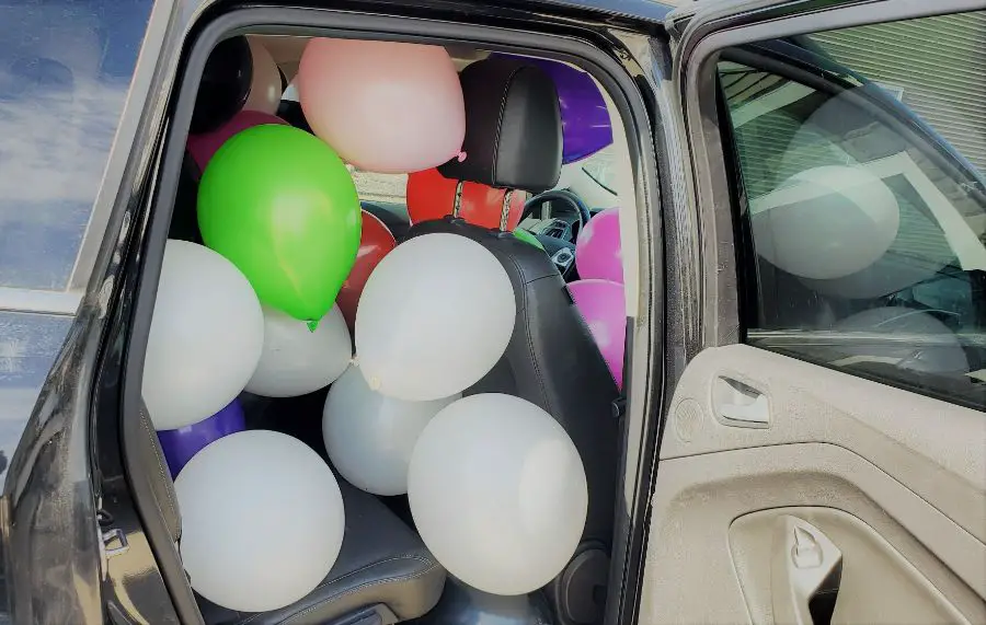 Car Filled to the Brim with Balloons