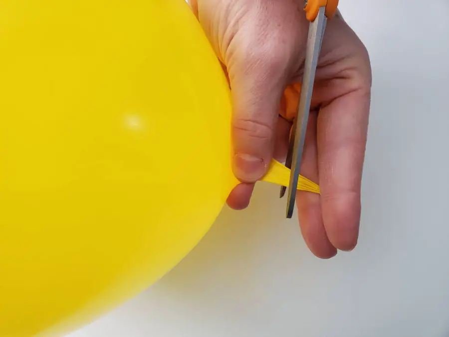 Cutting a Balloon to Pop Quietly