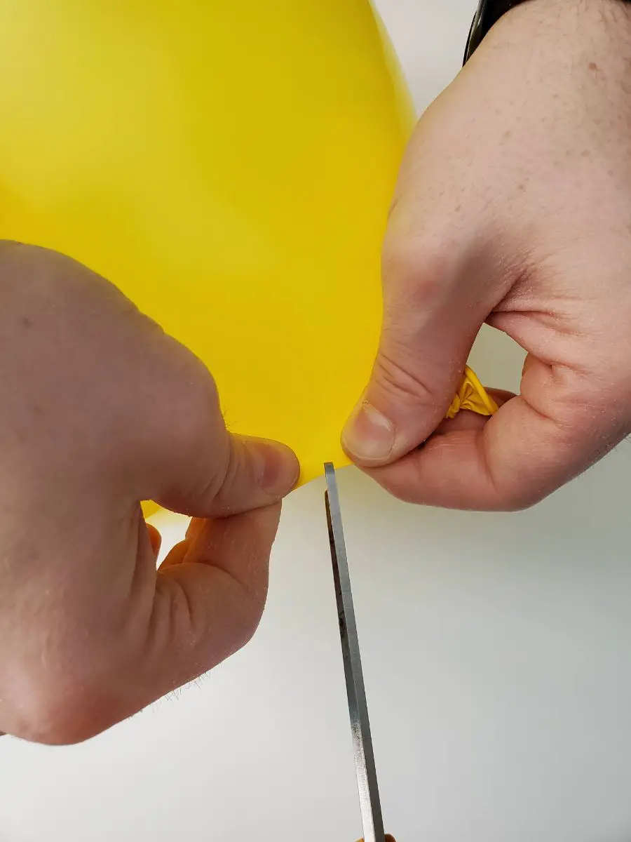 Pinching and Cutting a Balloon to Pop Quietly