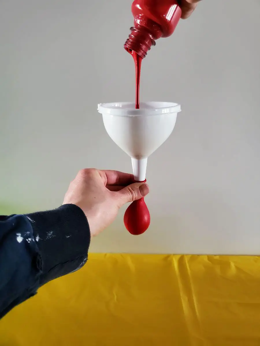 Funneling Paint into a Latex Balloon