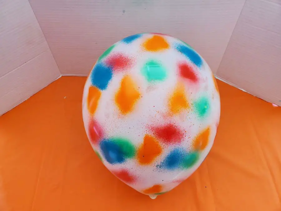 A Balloon Spray Painted with Multiple Colors
