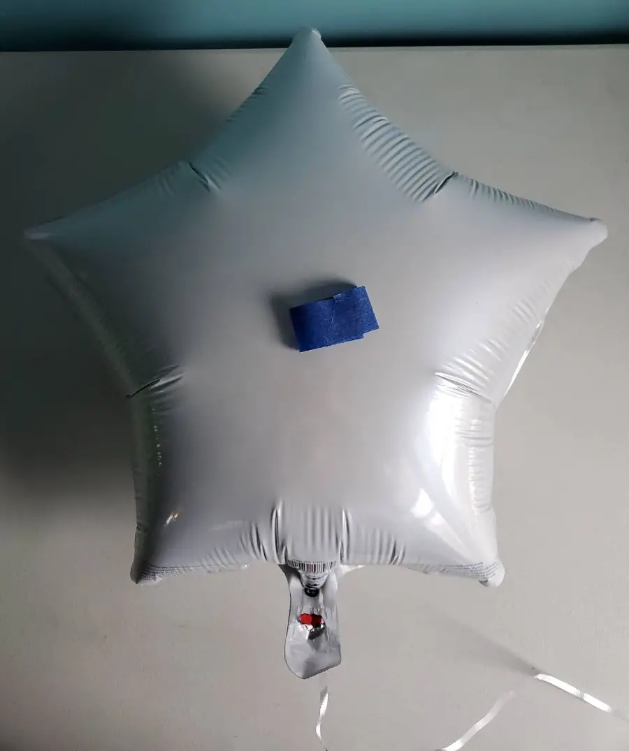 Taping Down a Foil Balloon