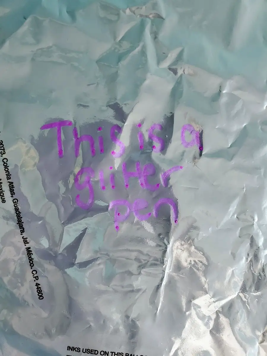 Writing on a Foil Balloon with a Glitter Pen
