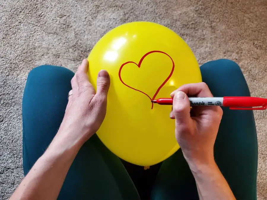 Writing on a Latex Balloon in Between Legs