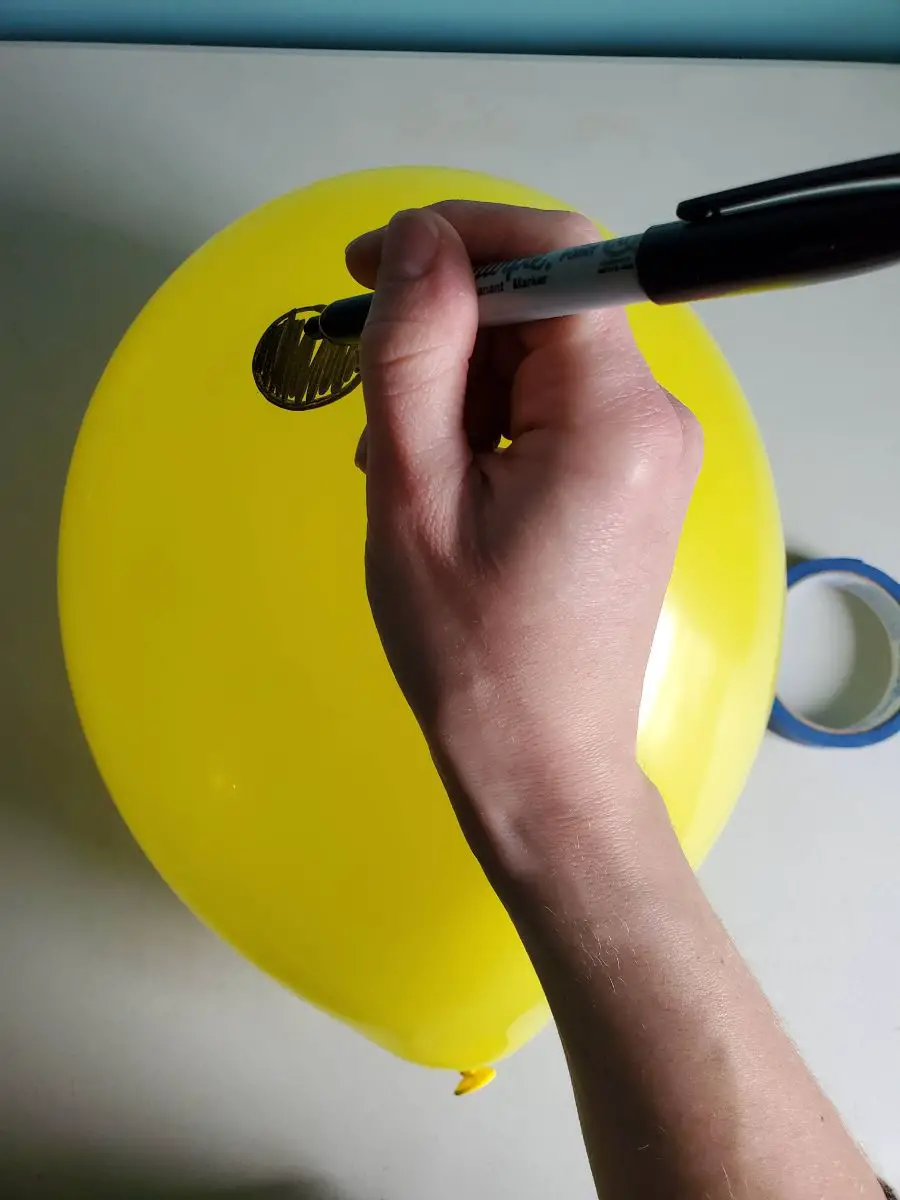 Writing on a Taped Down Latex Balloon