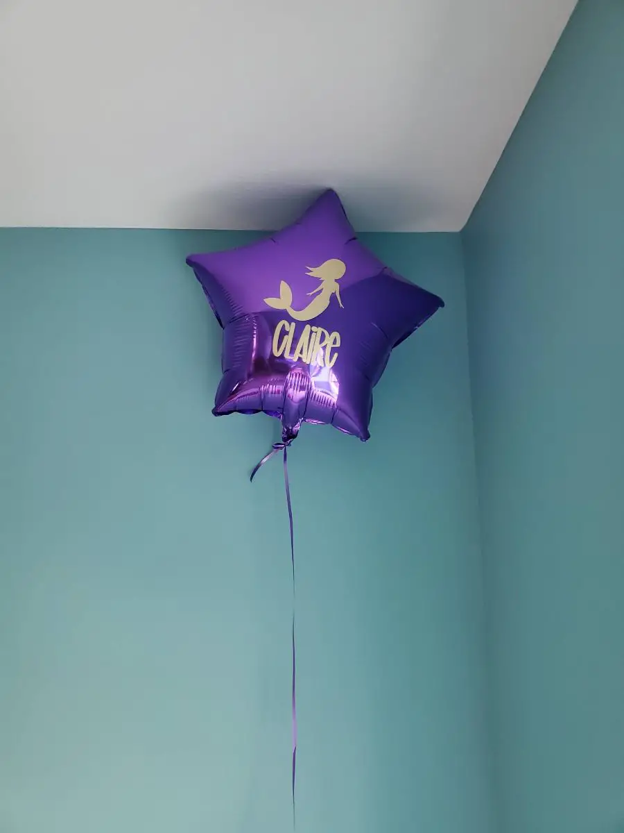 Foil Balloon Floating After Being Refilled with Helium